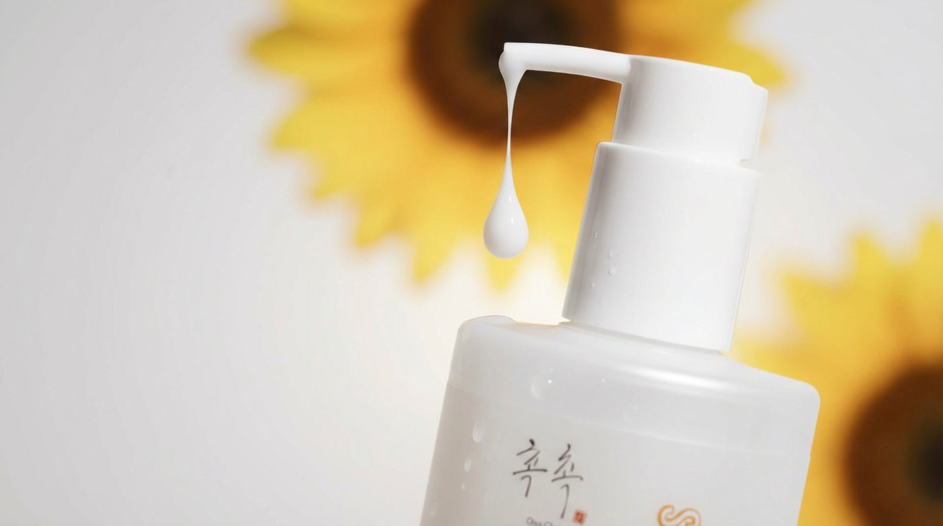 CHOC CHOC SKIN Milky Dew Drops milky toner hybrid pump dispensing a hydrating drop with sunflower-inspired background